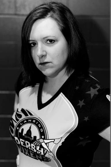 Addie Mortem (Jess Knott), blocker for the Lansing Derby Vixens. Photo by Jena McShane of McShane Photography.