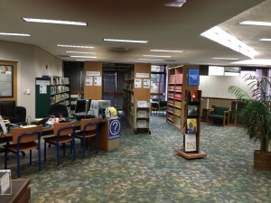 Stacks of books in a nook.
