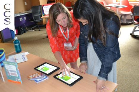 Workshop presenter and Catherine Cook 1st grade teacher Kate Herron demos ScratchJr for an IDEA:TE attendee.